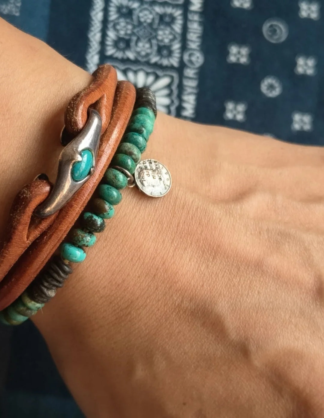 Leather rope bracelet paired with turquoise bracelet and silver jewelry