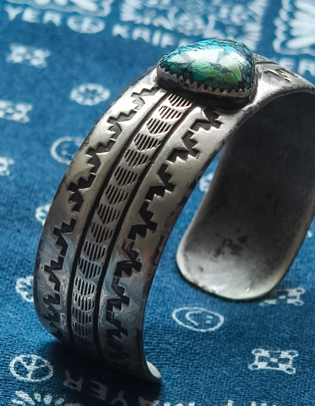 The simple turquoise ring with smooth lines and mysterious Indian totems gives a sense of antiquity and depth, full of a sense of story and the otherworldly charm of turquoise